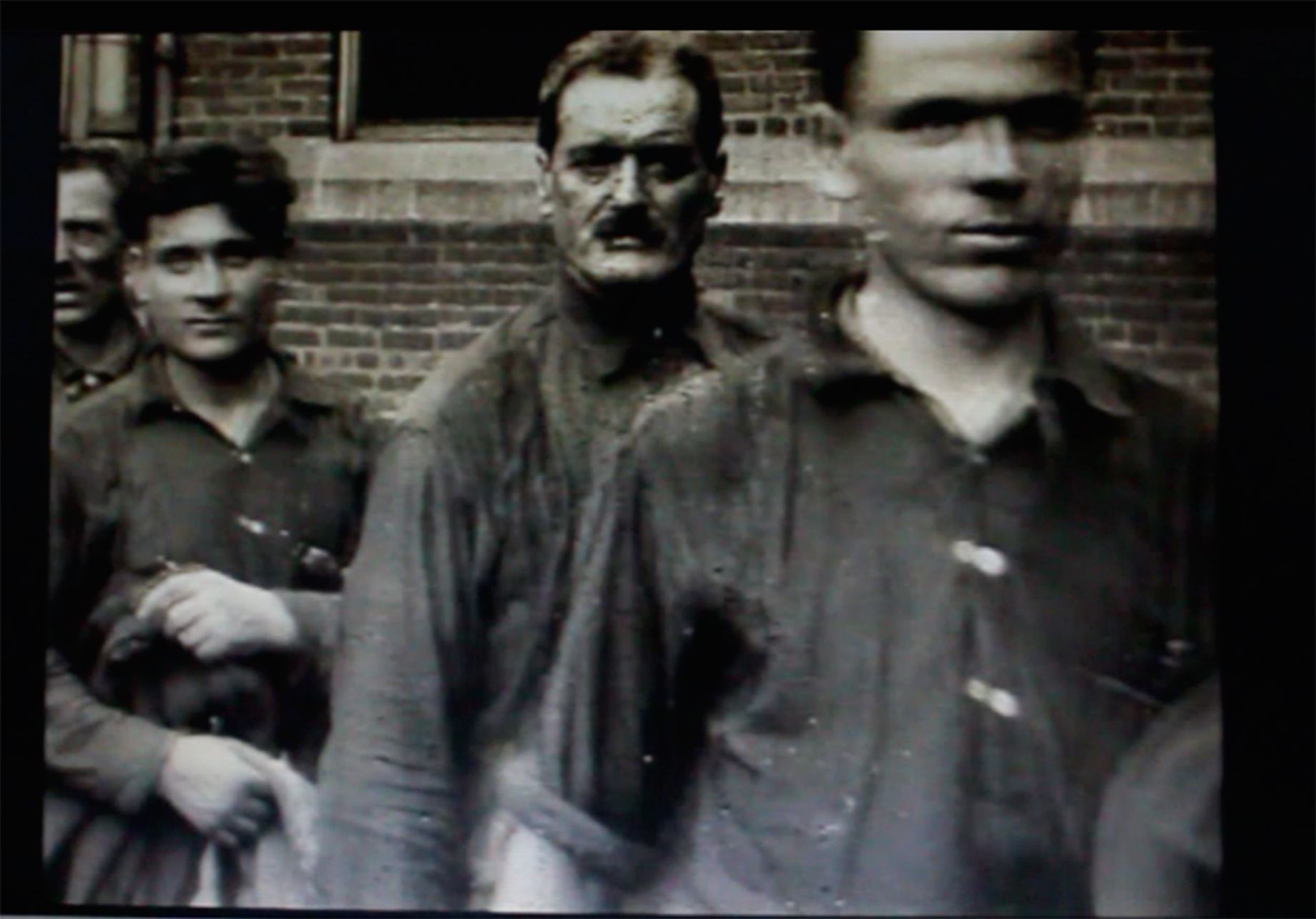 Still from a Ford Motion Picture Studio film showing foreign workers arriving to work in Detroit. Ford Film Collection, 1926